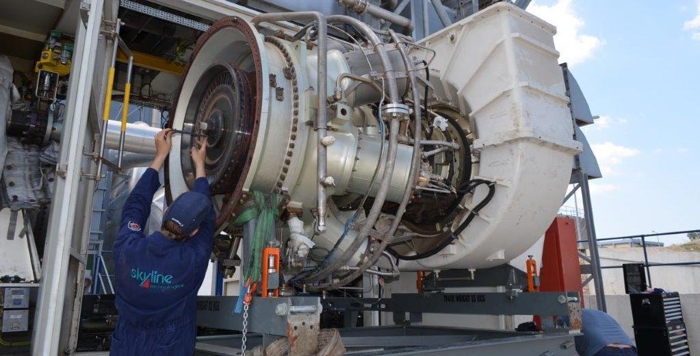 engineer repairing turbine engine